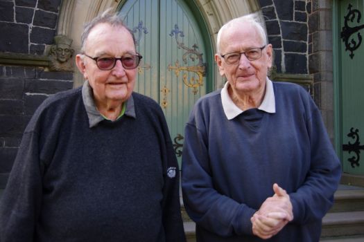 Fathers Paul and Tony outside a church