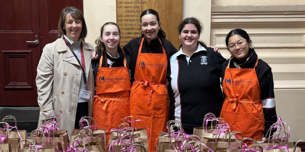 The students standing together behind the Beauty Bags Stall at the Fair.